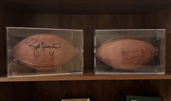 ($1600.00) Item #50 Reggie White & Brett Favre Autographed Super Bowl XXXI Footballs Each In a Case