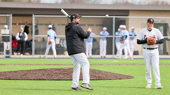 Coach Xander Helton (12)
